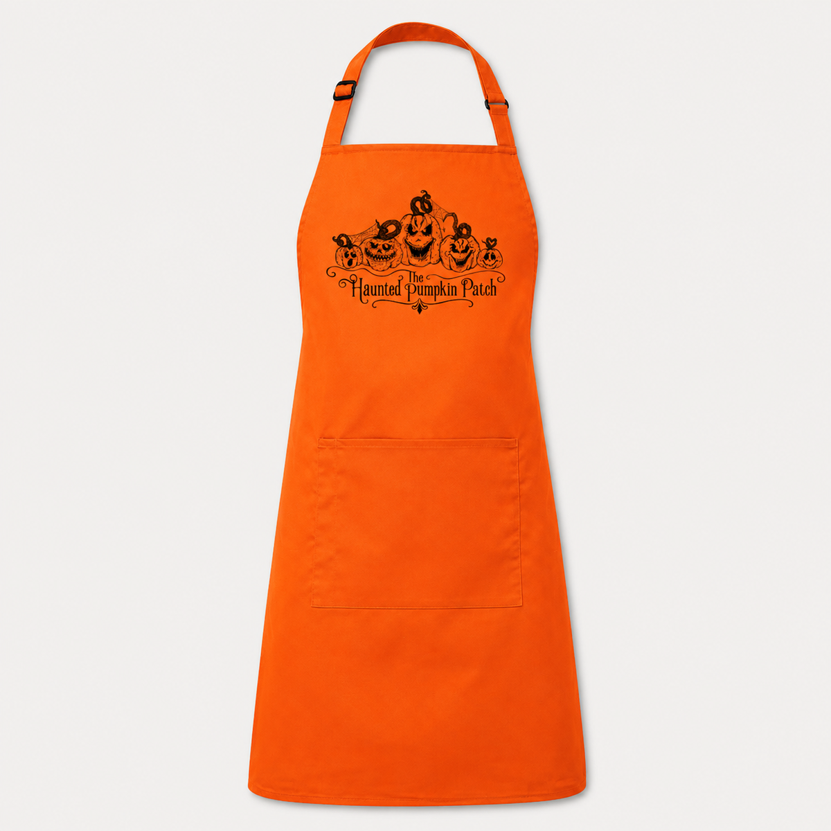 The Haunted Pumpkin Patch Artisan Apron in orange