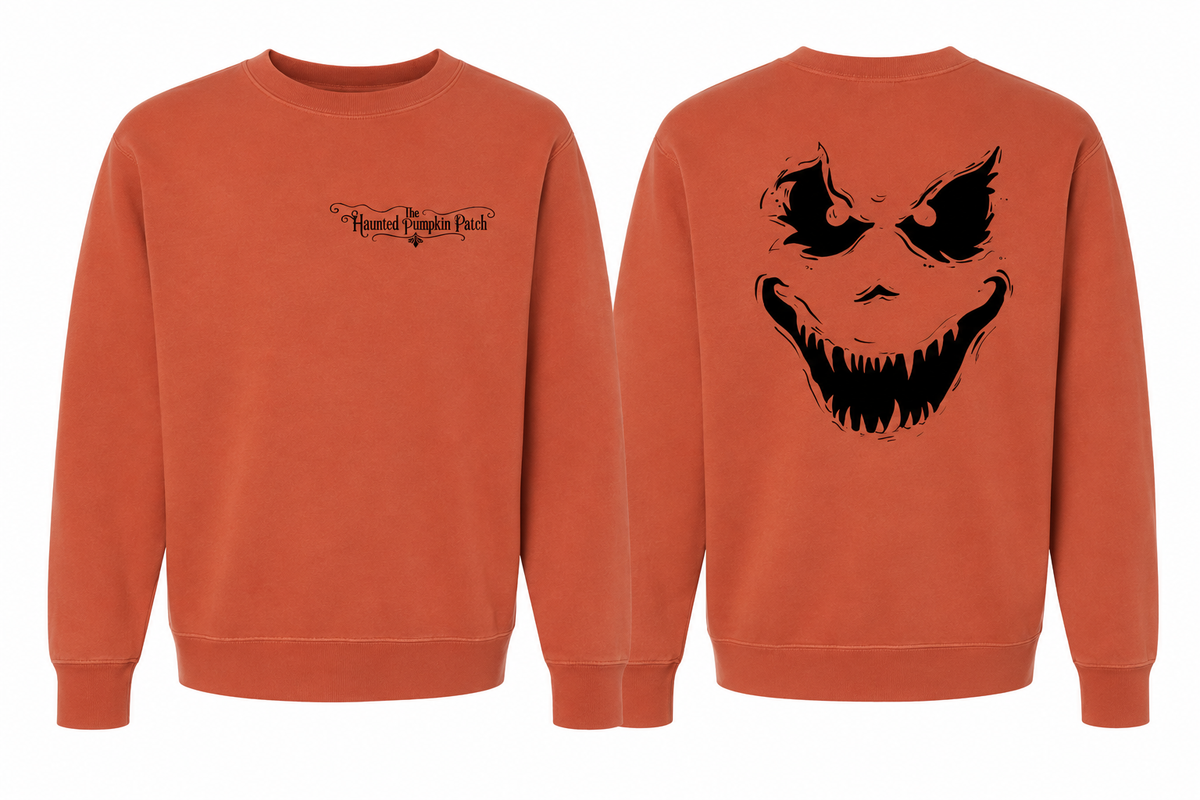 Scary crewneck in Pigment Amber for sizes Large and 2XL — small black front chest wordmark and large black pumpkin face on back